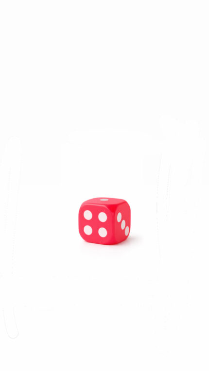 Mini dé rose à lumière brillant dans le noir